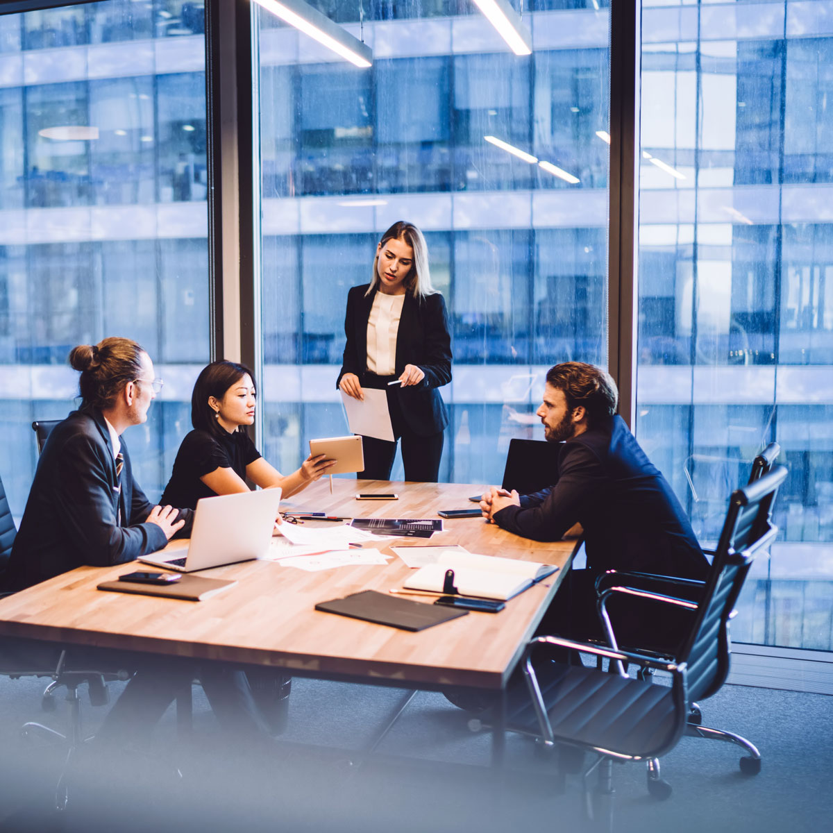 finance employees working together in a conference room