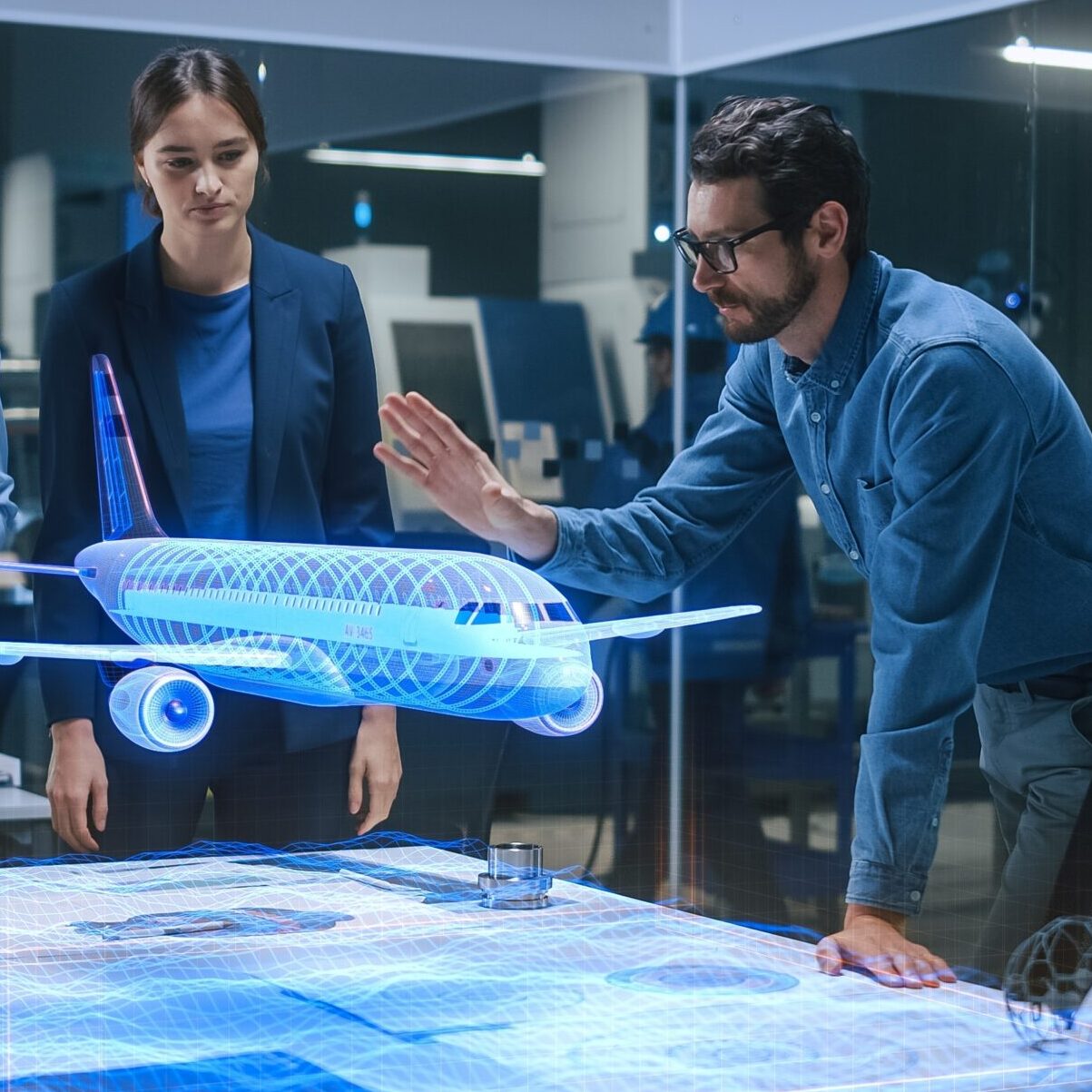 a man and a woman are looking at a model airplane